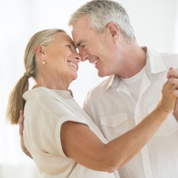 Romantic Couple Dancing At Home Romantic senior couple dancing at home